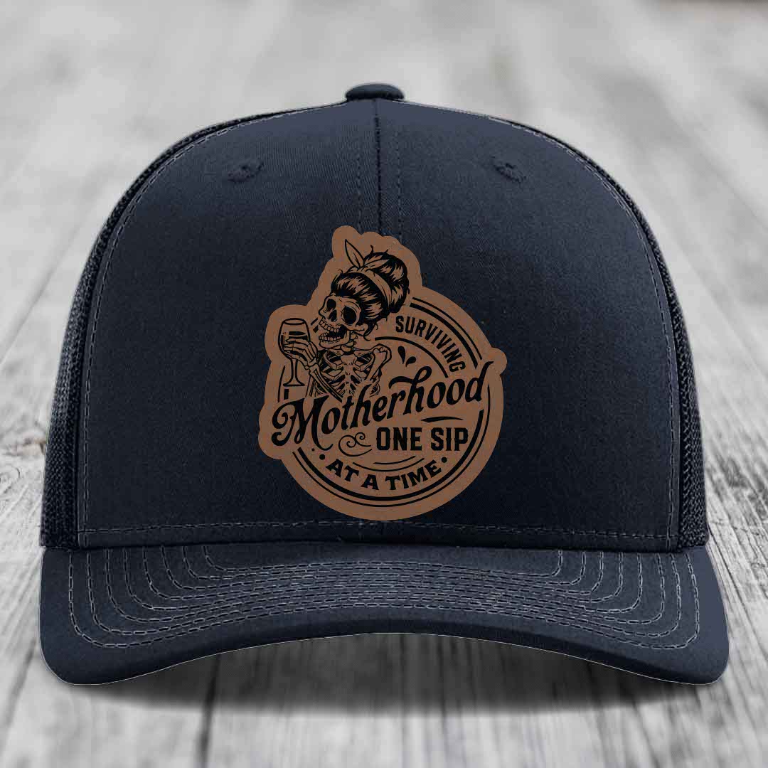 Surviving Motherhood, One Sip At A Time - Leather Patch Hat - Dark Brown to Black Patch - Richardson 112 Snapback Trucker Hat