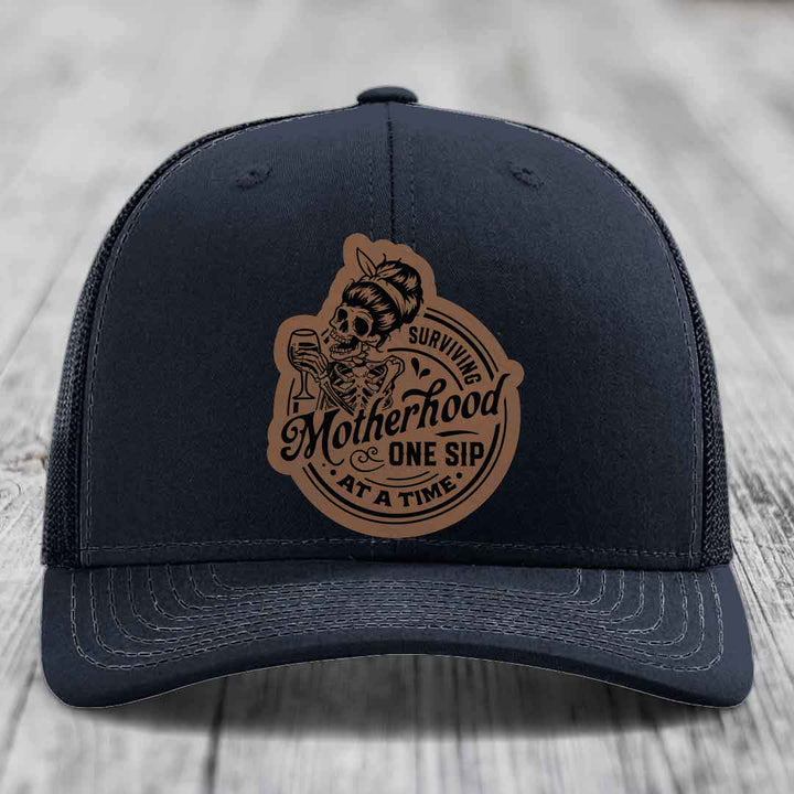 Surviving Motherhood, One Sip At A Time - Leather Patch Hat - Dark Brown to Black Patch - Richardson 112 Snapback Trucker Hat