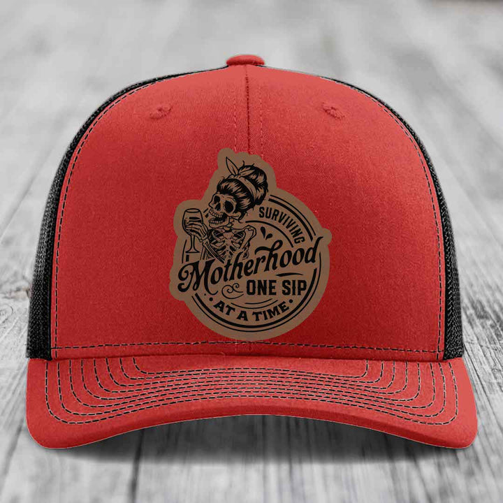 Surviving Motherhood, One Sip At A Time - Leather Patch Hat - Dark Brown to Black Patch - Richardson 112 Snapback Trucker Hat