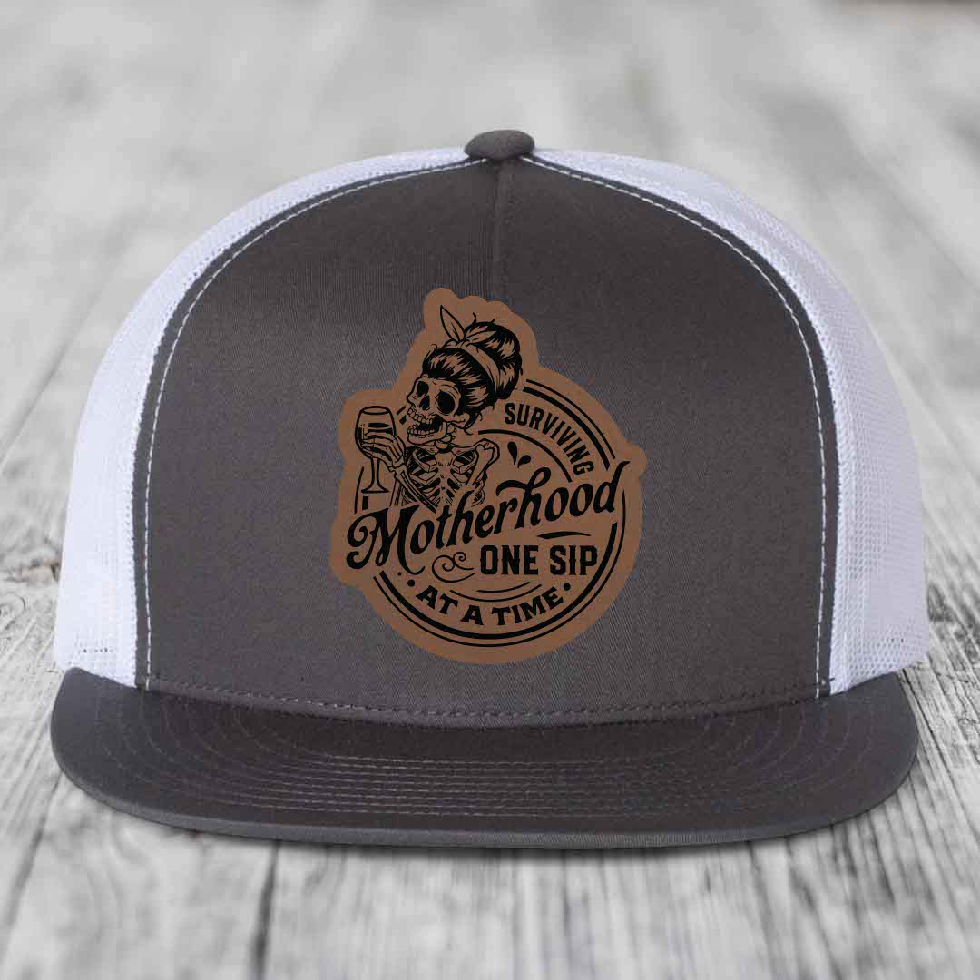 Surviving Motherhood, One Sip At A Time - Leather Patch Hat - Dark Brown to Black Patch - Yupoong 6006 Snapback Flatbill Hat