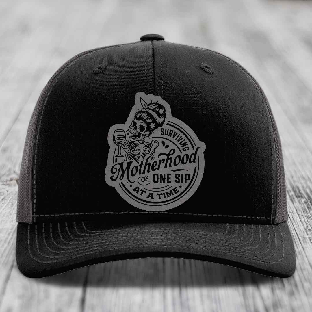 Surviving Motherhood, One Sip At A Time - Leather Patch Hat - Grey to Black Patch - Richardson 112 Snapback Trucker Hat