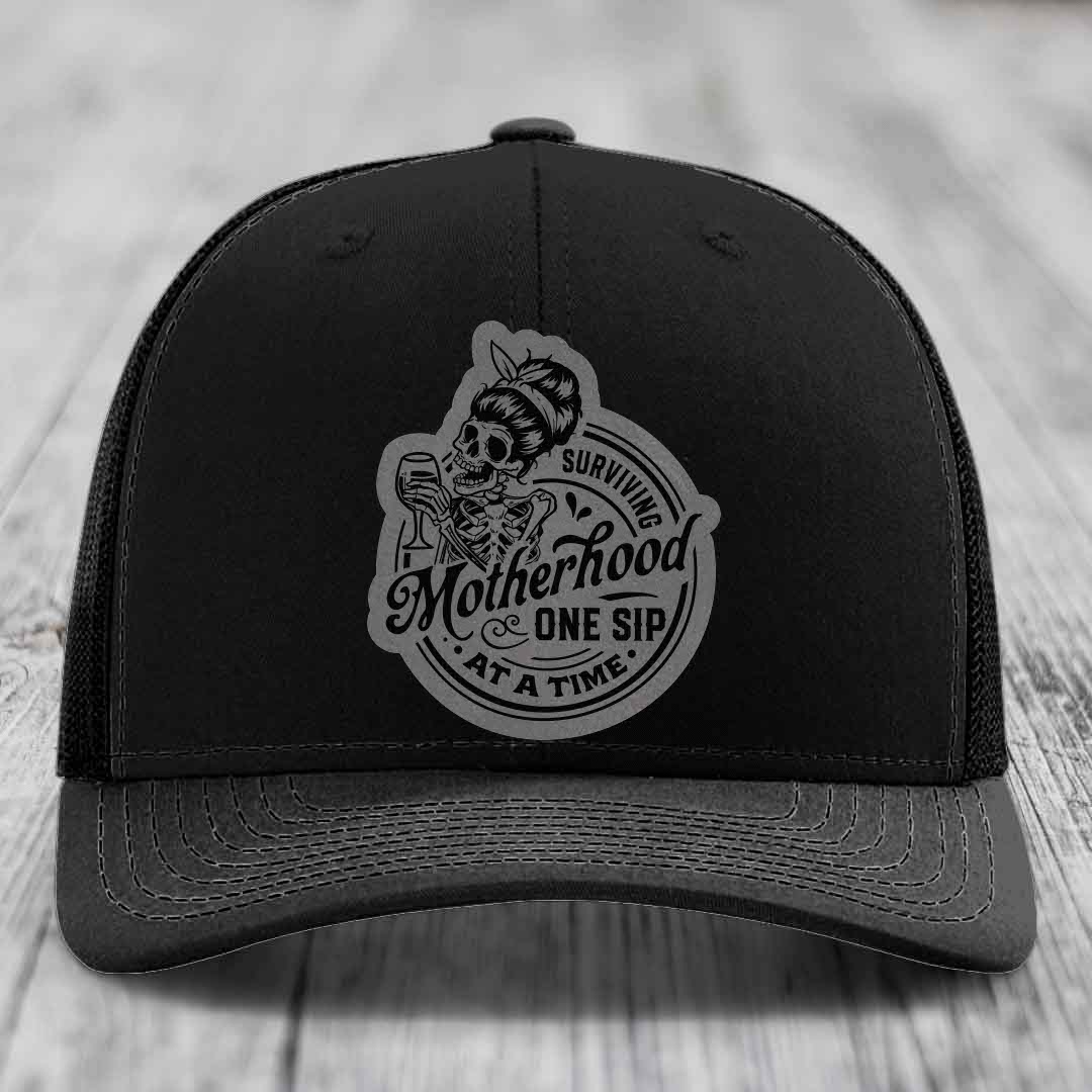 Surviving Motherhood, One Sip At A Time - Leather Patch Hat - Grey to Black Patch - Richardson 112 Snapback Trucker Hat