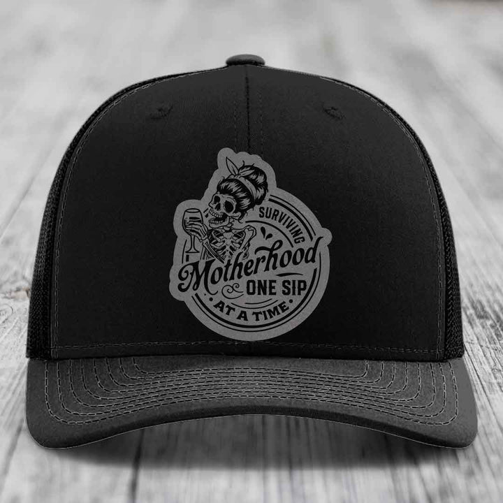 Surviving Motherhood, One Sip At A Time - Leather Patch Hat - Grey to Black Patch - Richardson 112 Snapback Trucker Hat
