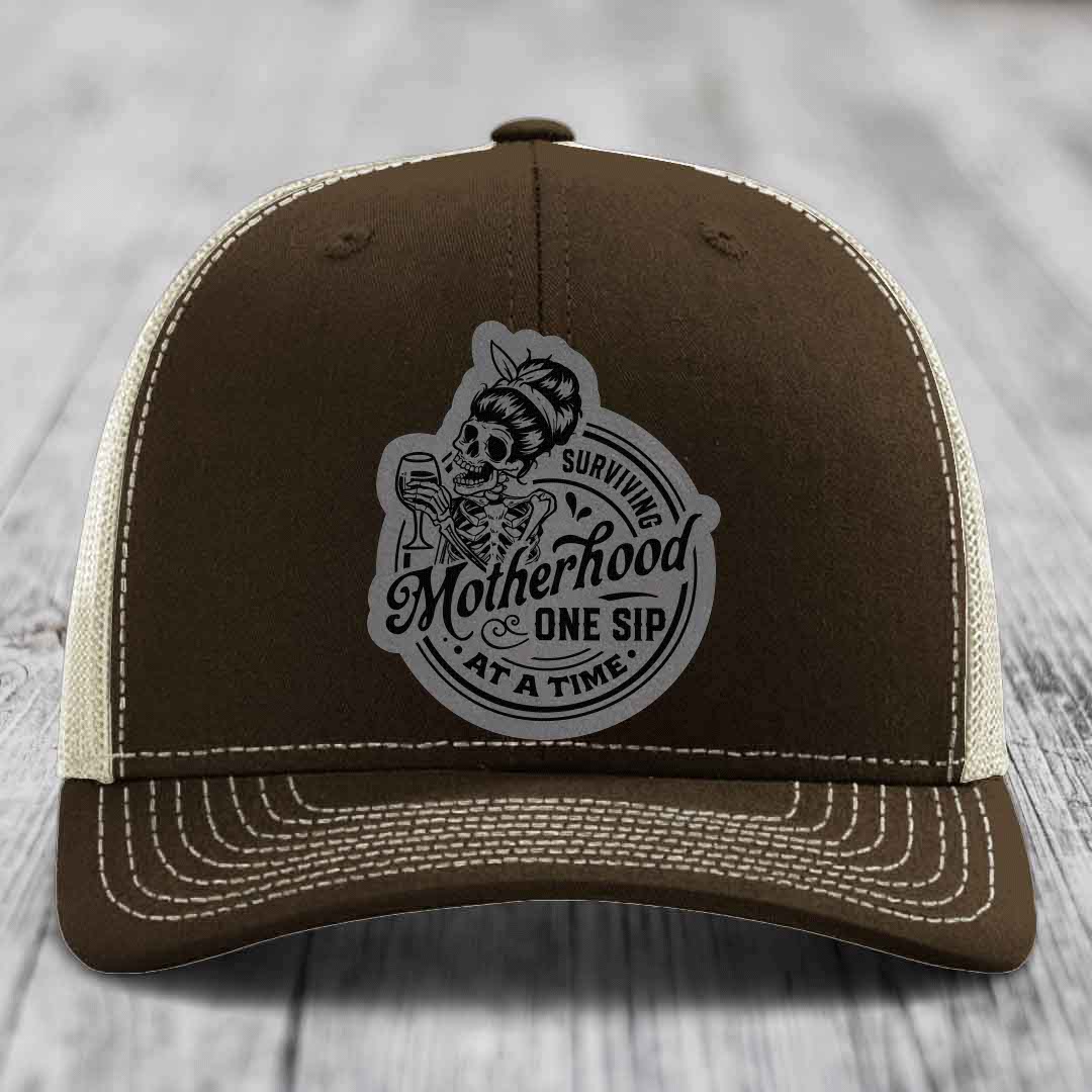 Surviving Motherhood, One Sip At A Time - Leather Patch Hat - Grey to Black Patch - Richardson 112 Snapback Trucker Hat