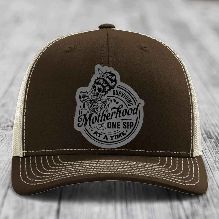 Surviving Motherhood, One Sip At A Time - Leather Patch Hat - Grey to Black Patch - Richardson 112 Snapback Trucker Hat