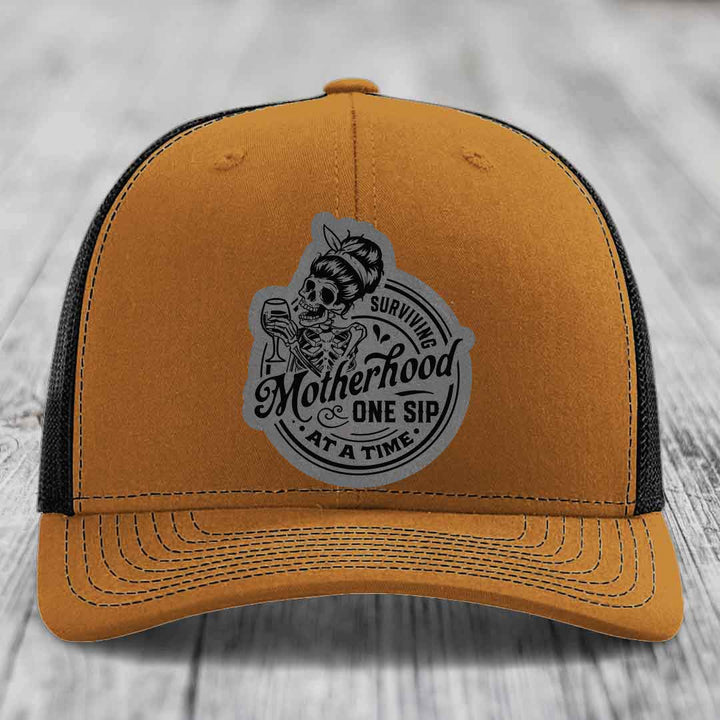 Surviving Motherhood, One Sip At A Time - Leather Patch Hat - Grey to Black Patch - Richardson 112 Snapback Trucker Hat