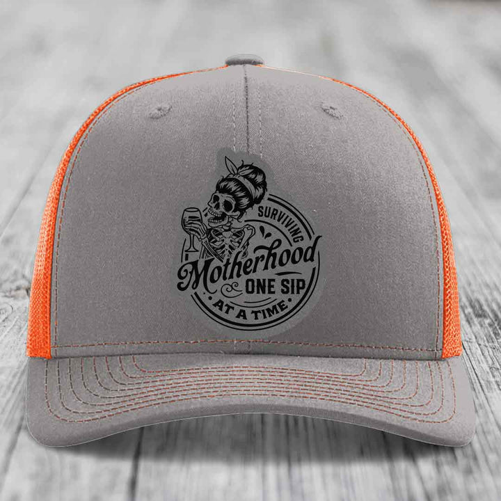 Surviving Motherhood, One Sip At A Time - Leather Patch Hat - Grey to Black Patch - Richardson 112 Snapback Trucker Hat