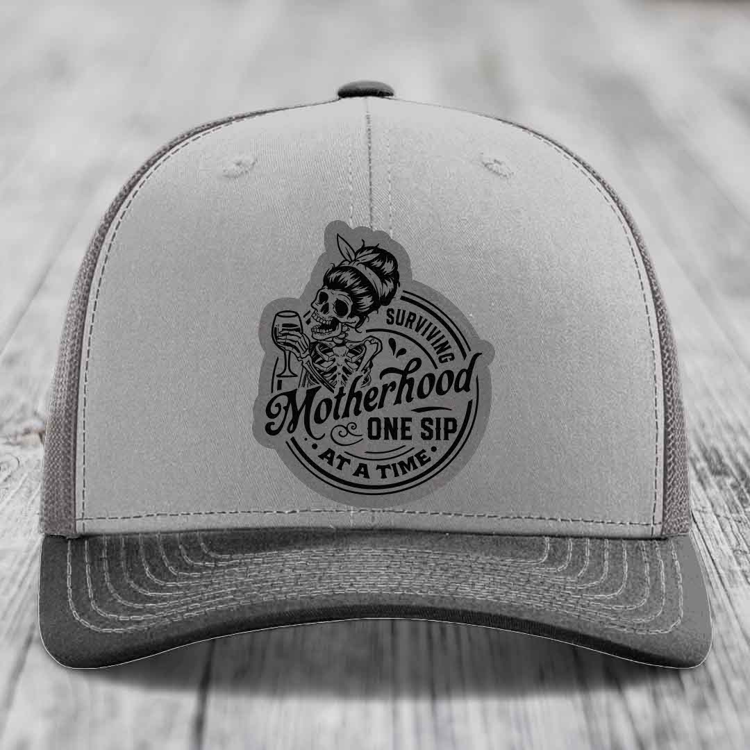 Surviving Motherhood, One Sip At A Time - Leather Patch Hat - Grey to Black Patch - Richardson 112 Snapback Trucker Hat