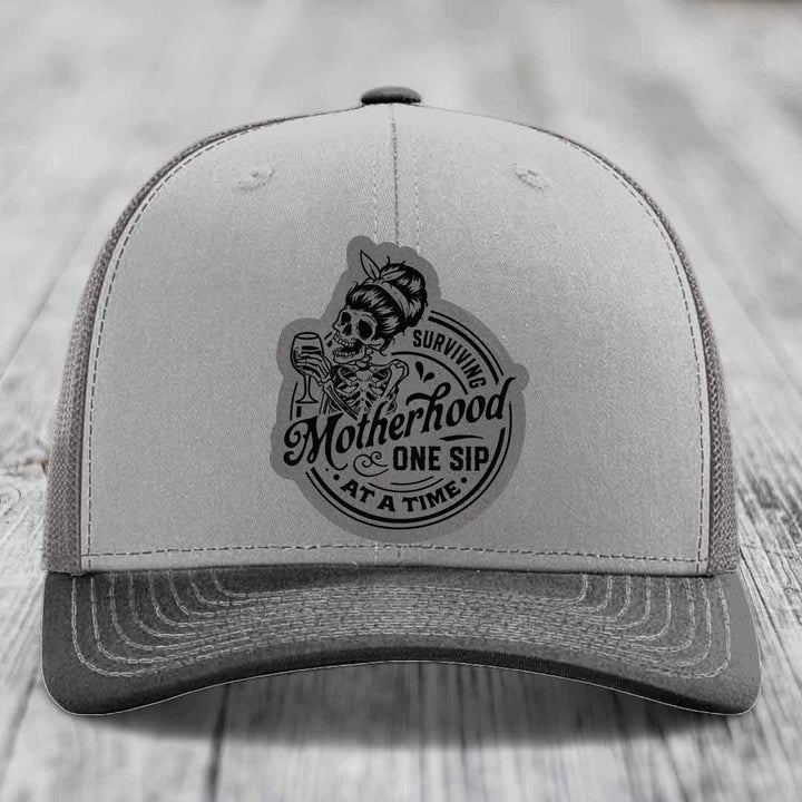 Surviving Motherhood, One Sip At A Time - Leather Patch Hat - Grey to Black Patch - Richardson 112 Snapback Trucker Hat