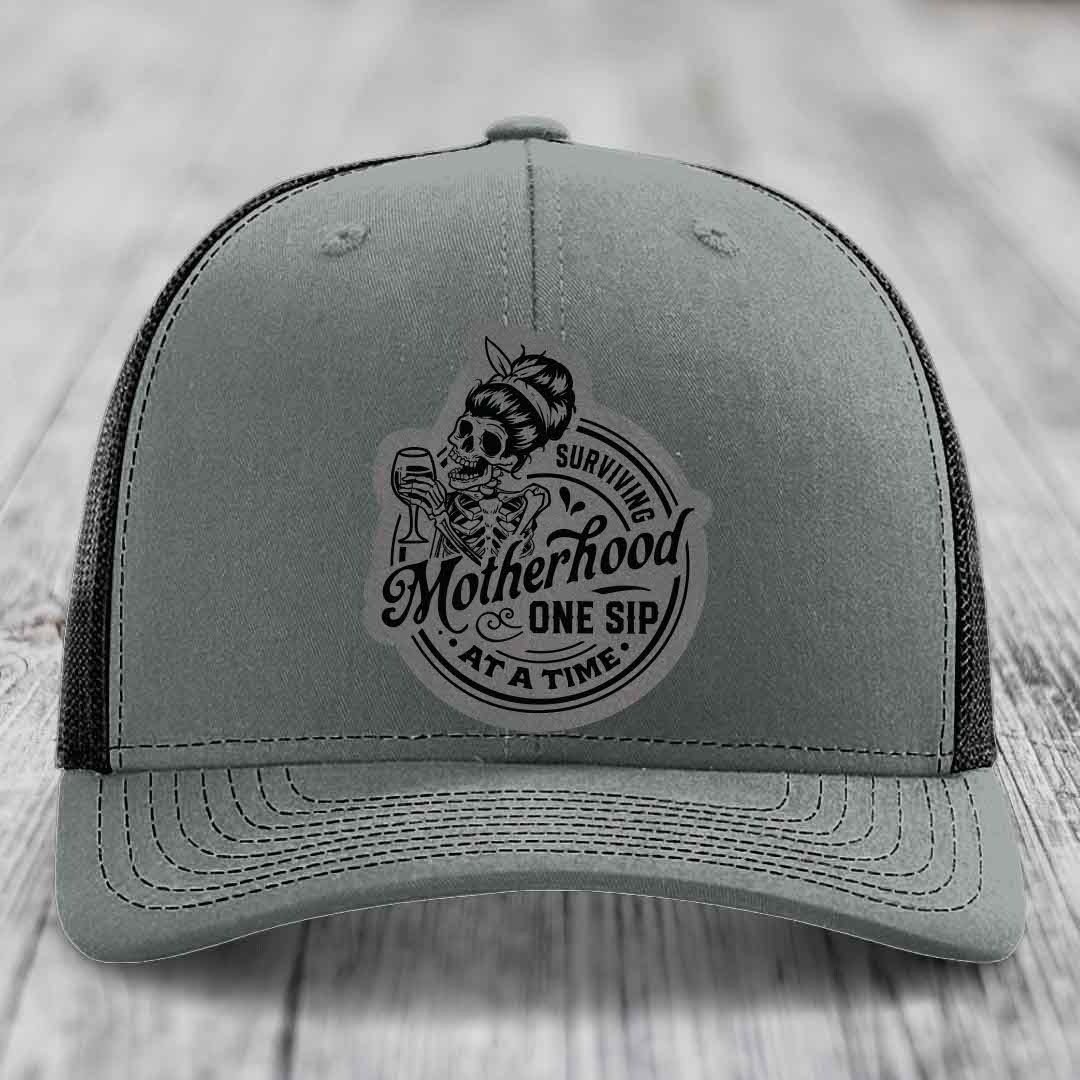 Surviving Motherhood, One Sip At A Time - Leather Patch Hat - Grey to Black Patch - Richardson 112 Snapback Trucker Hat