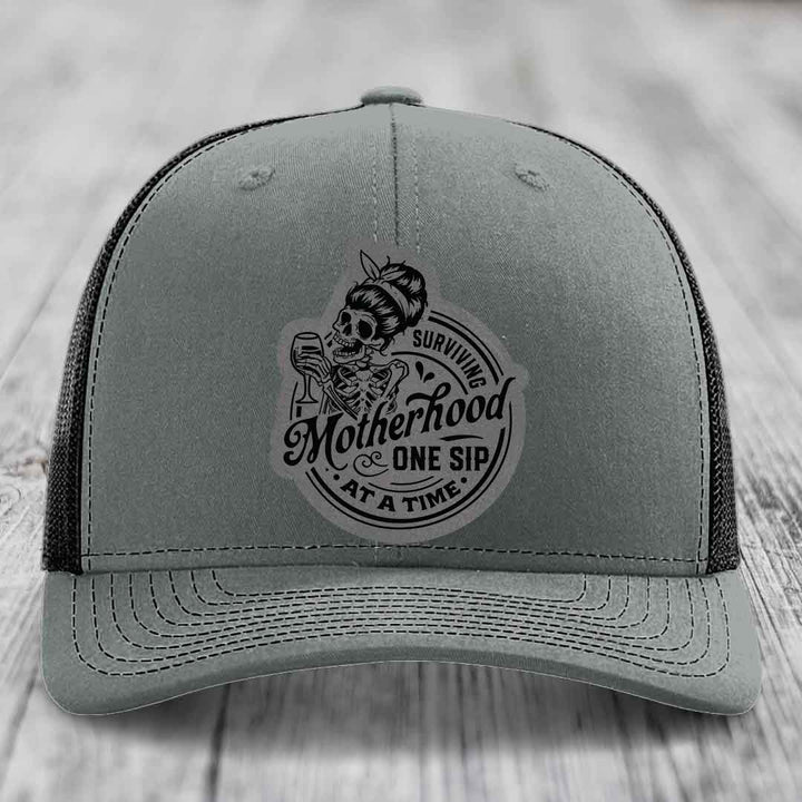 Surviving Motherhood, One Sip At A Time - Leather Patch Hat - Grey to Black Patch - Richardson 112 Snapback Trucker Hat