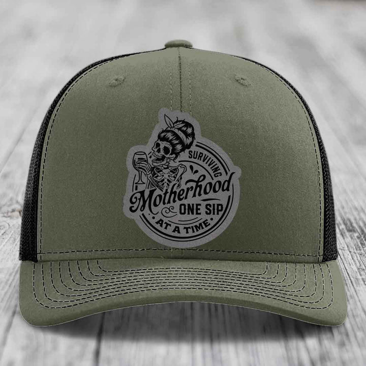 Surviving Motherhood, One Sip At A Time - Leather Patch Hat - Grey to Black Patch - Richardson 112 Snapback Trucker Hat