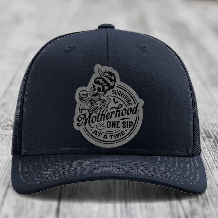 Surviving Motherhood, One Sip At A Time - Leather Patch Hat - Grey to Black Patch - Richardson 112 Snapback Trucker Hat