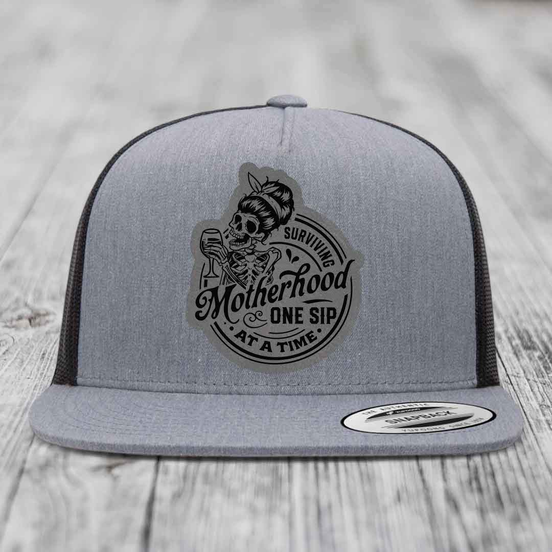 Surviving Motherhood, One Sip At A Time - Leather Patch Hat - Grey to Black Patch - Yupoong 6006 Snapback Flatbill Hat