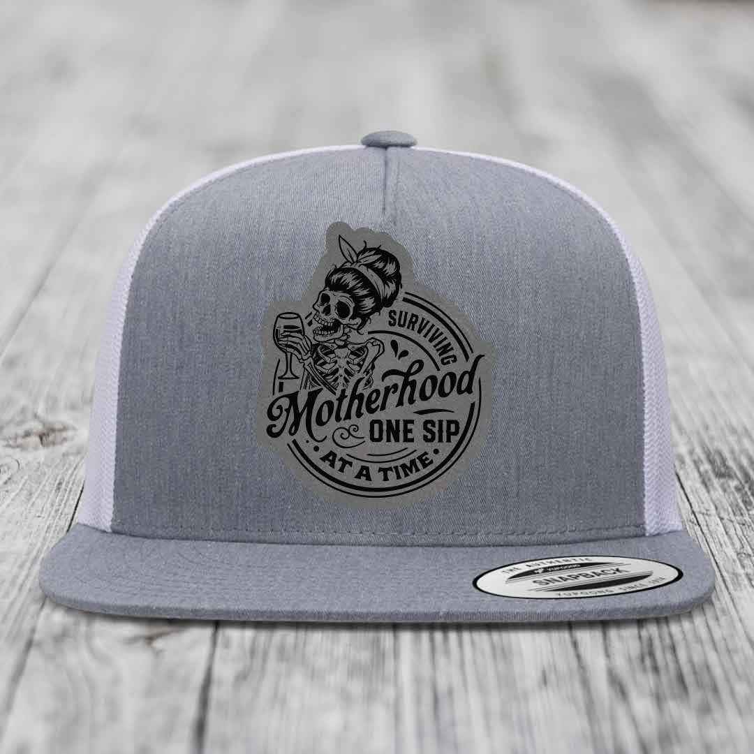 Surviving Motherhood, One Sip At A Time - Leather Patch Hat - Grey to Black Patch - Yupoong 6006 Snapback Flatbill Hat