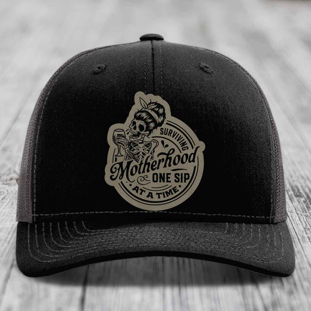 Surviving Motherhood, One Sip At A Time - Leather Patch Hat - Light Brown to Black Patch - Richardson 112 Snapback Trucker Hat
