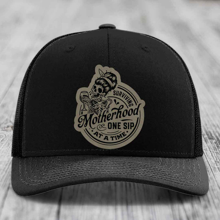 Surviving Motherhood, One Sip At A Time - Leather Patch Hat - Light Brown to Black Patch - Richardson 112 Snapback Trucker Hat