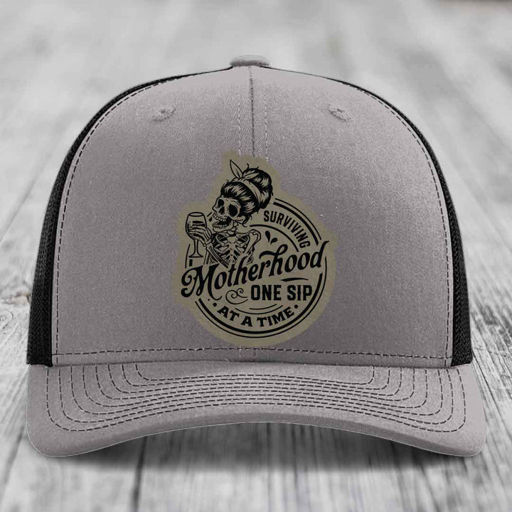 Surviving Motherhood, One Sip At A Time - Leather Patch Hat - Light Brown to Black Patch - Richardson 112 Snapback Trucker Hat