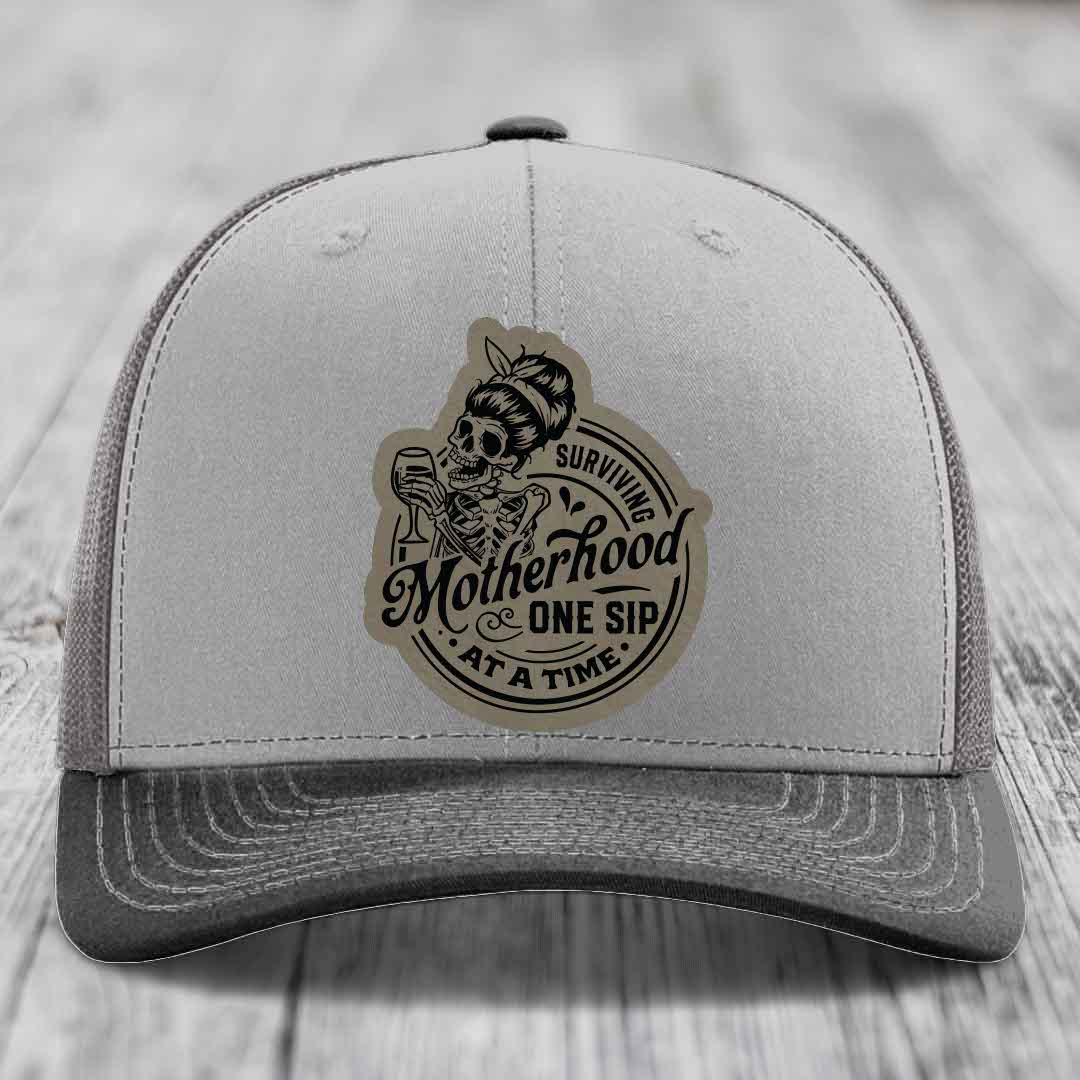 Surviving Motherhood, One Sip At A Time - Leather Patch Hat - Light Brown to Black Patch - Richardson 112 Snapback Trucker Hat