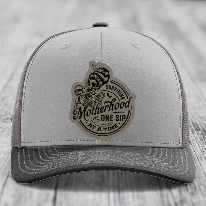 Surviving Motherhood, One Sip At A Time - Leather Patch Hat - Light Brown to Black Patch - Richardson 112 Snapback Trucker Hat