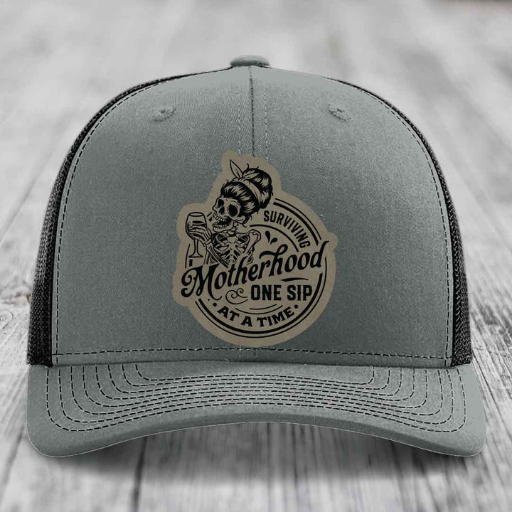 Surviving Motherhood, One Sip At A Time - Leather Patch Hat - Light Brown to Black Patch - Richardson 112 Snapback Trucker Hat