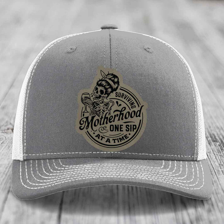 Surviving Motherhood, One Sip At A Time - Leather Patch Hat - Light Brown to Black Patch - Richardson 112 Snapback Trucker Hat