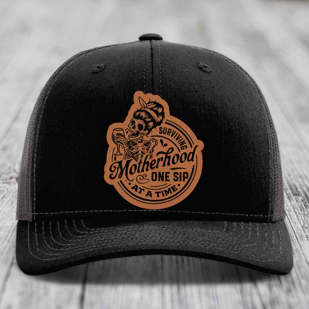 Surviving Motherhood, One Sip At A Time - Leather Patch Hat - Rawhide to Black Patch - Richardson 112 Snapback Trucker Hat