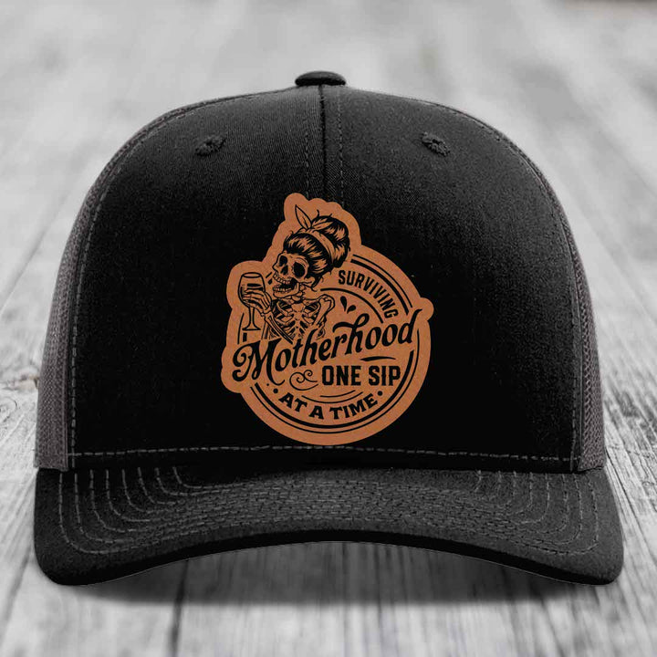 Surviving Motherhood, One Sip At A Time - Leather Patch Hat - Rawhide to Black Patch - Richardson 112 Snapback Trucker Hat