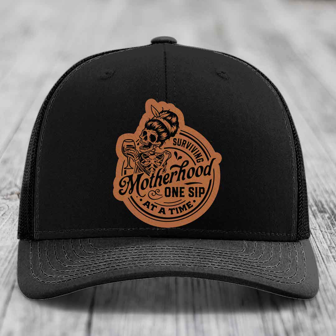 Surviving Motherhood, One Sip At A Time - Leather Patch Hat - Rawhide to Black Patch - Richardson 112 Snapback Trucker Hat