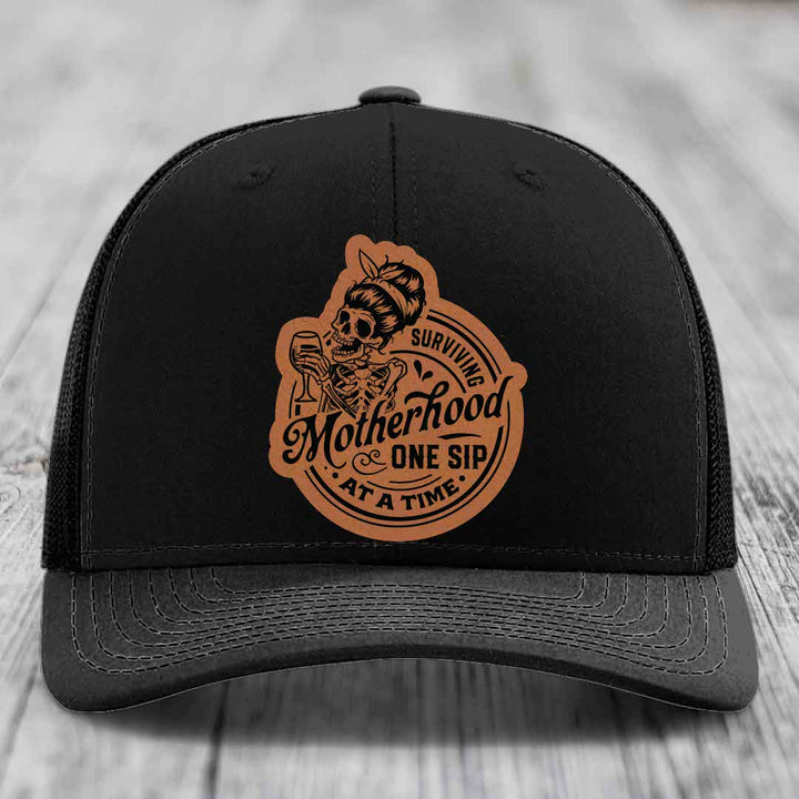 Surviving Motherhood, One Sip At A Time - Leather Patch Hat - Rawhide to Black Patch - Richardson 112 Snapback Trucker Hat