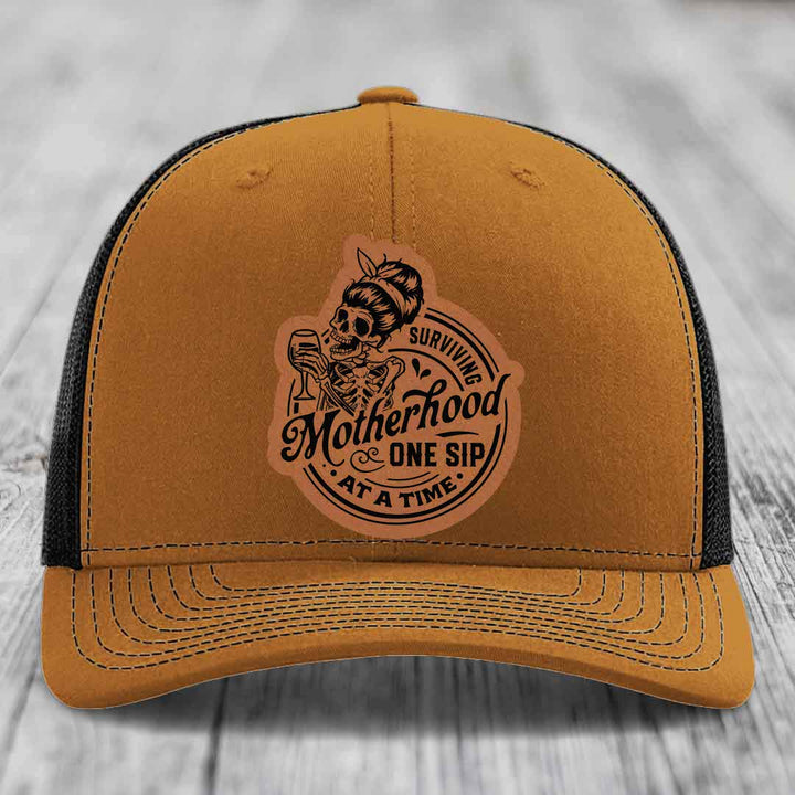 Surviving Motherhood, One Sip At A Time - Leather Patch Hat - Rawhide to Black Patch - Richardson 112 Snapback Trucker Hat