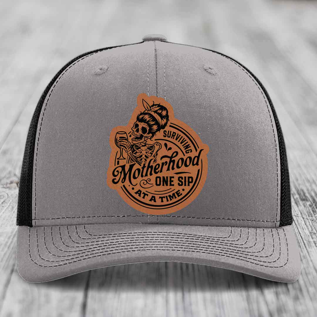 Surviving Motherhood, One Sip At A Time - Leather Patch Hat - Rawhide to Black Patch - Richardson 112 Snapback Trucker Hat
