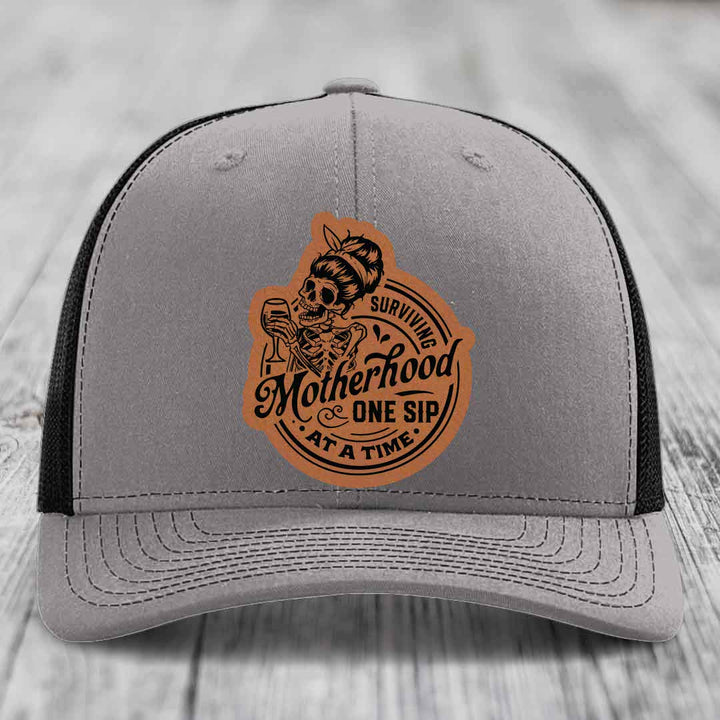Surviving Motherhood, One Sip At A Time - Leather Patch Hat - Rawhide to Black Patch - Richardson 112 Snapback Trucker Hat