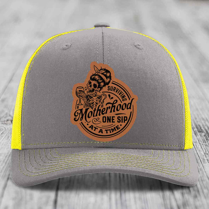 Surviving Motherhood, One Sip At A Time - Leather Patch Hat - Rawhide to Black Patch - Richardson 112 Snapback Trucker Hat