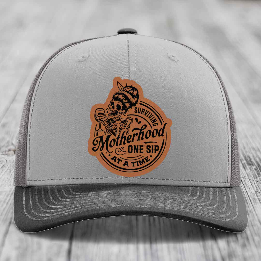 Surviving Motherhood, One Sip At A Time - Leather Patch Hat - Rawhide to Black Patch - Richardson 112 Snapback Trucker Hat
