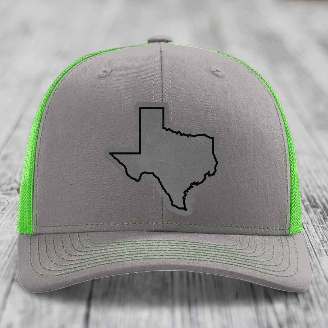 Grey trucker hat with neon green mesh and black Texas state outline patch on front.