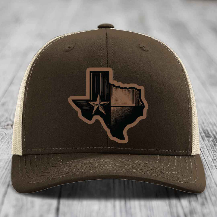Brown trucker hat with Texas-shaped leather patch featuring star and stripes design.