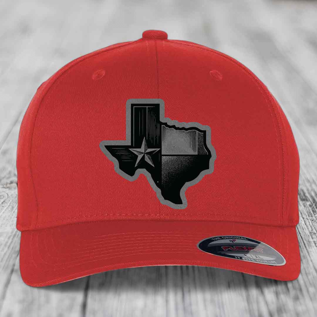 Red baseball cap with black Texas-shaped patch featuring a star and stripes design.