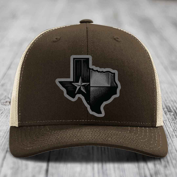 Brown trucker hat with Texas state outline patch featuring star and black-and-grey design.