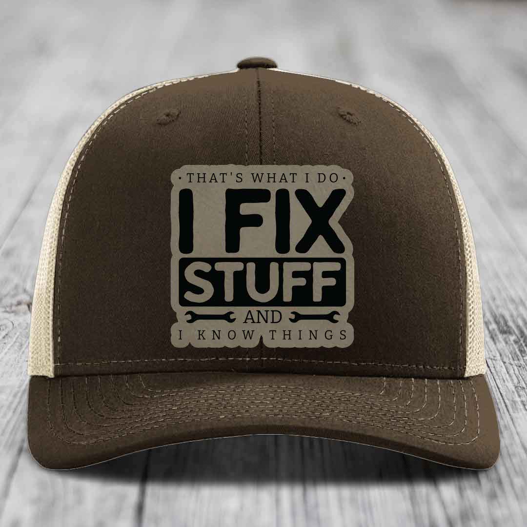 Brown trucker hat with beige mesh back and embroidered patch reading &