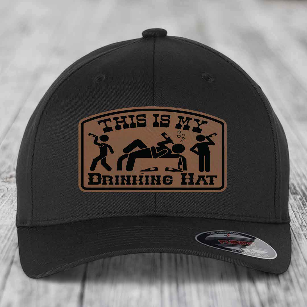 Black baseball cap with tan leather patch reading &
