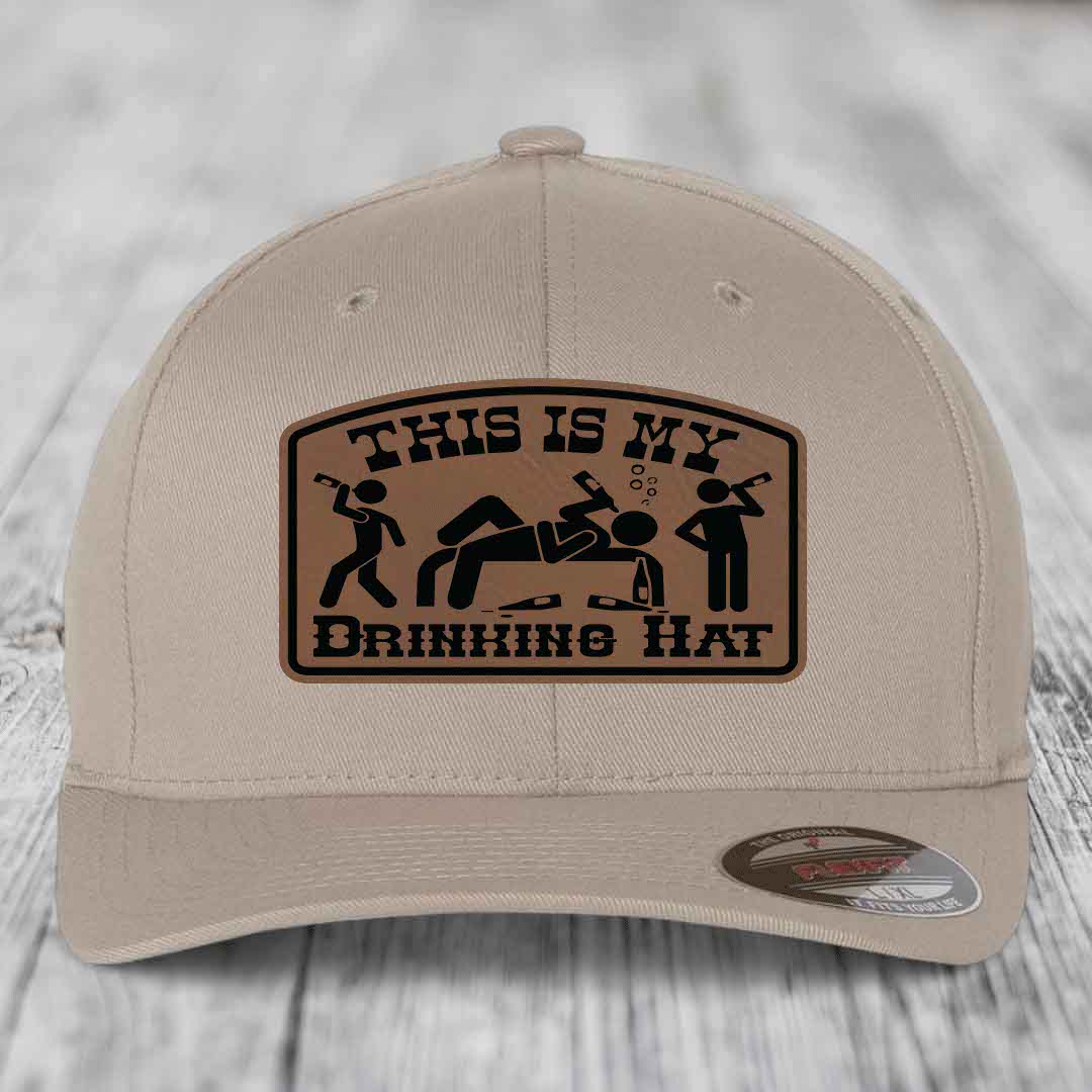 Beige baseball cap with brown leather patch reading &