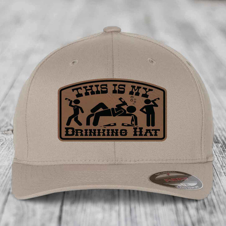 Beige baseball cap with brown leather patch reading &