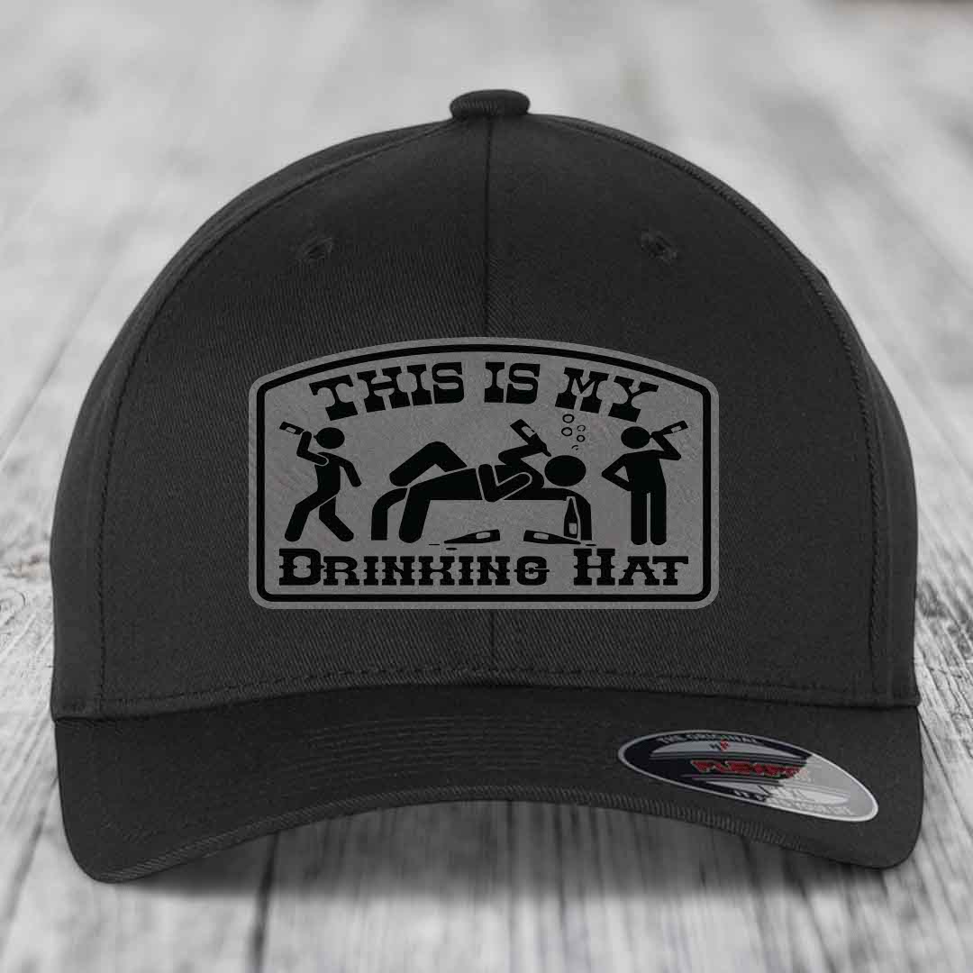 Black baseball cap with a gray patch reading &