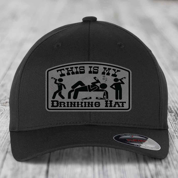 Black baseball cap with a gray patch reading &