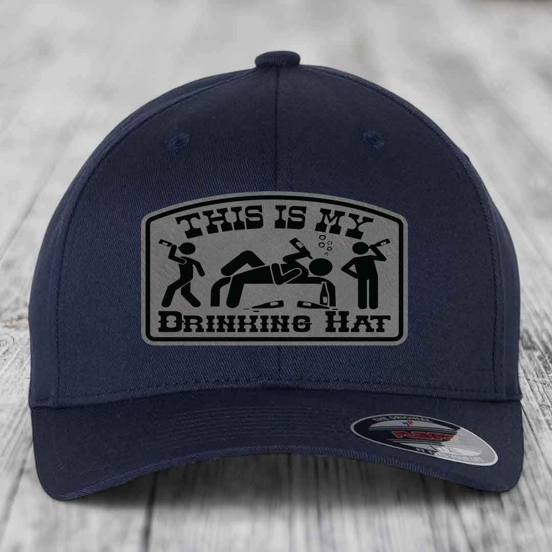 Dark blue baseball cap with a grey patch that reads &