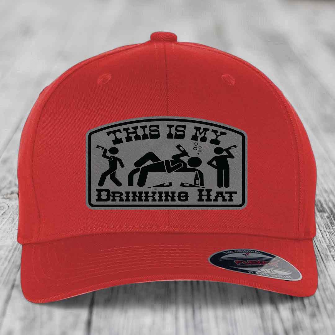 Red baseball cap with a grey patch that reads &