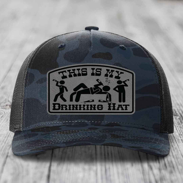 Camouflage trucker hat with a black and gray &