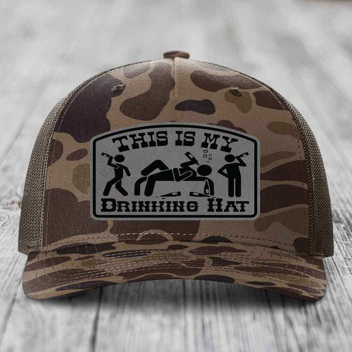 Camouflage trucker hat with a black and grey &