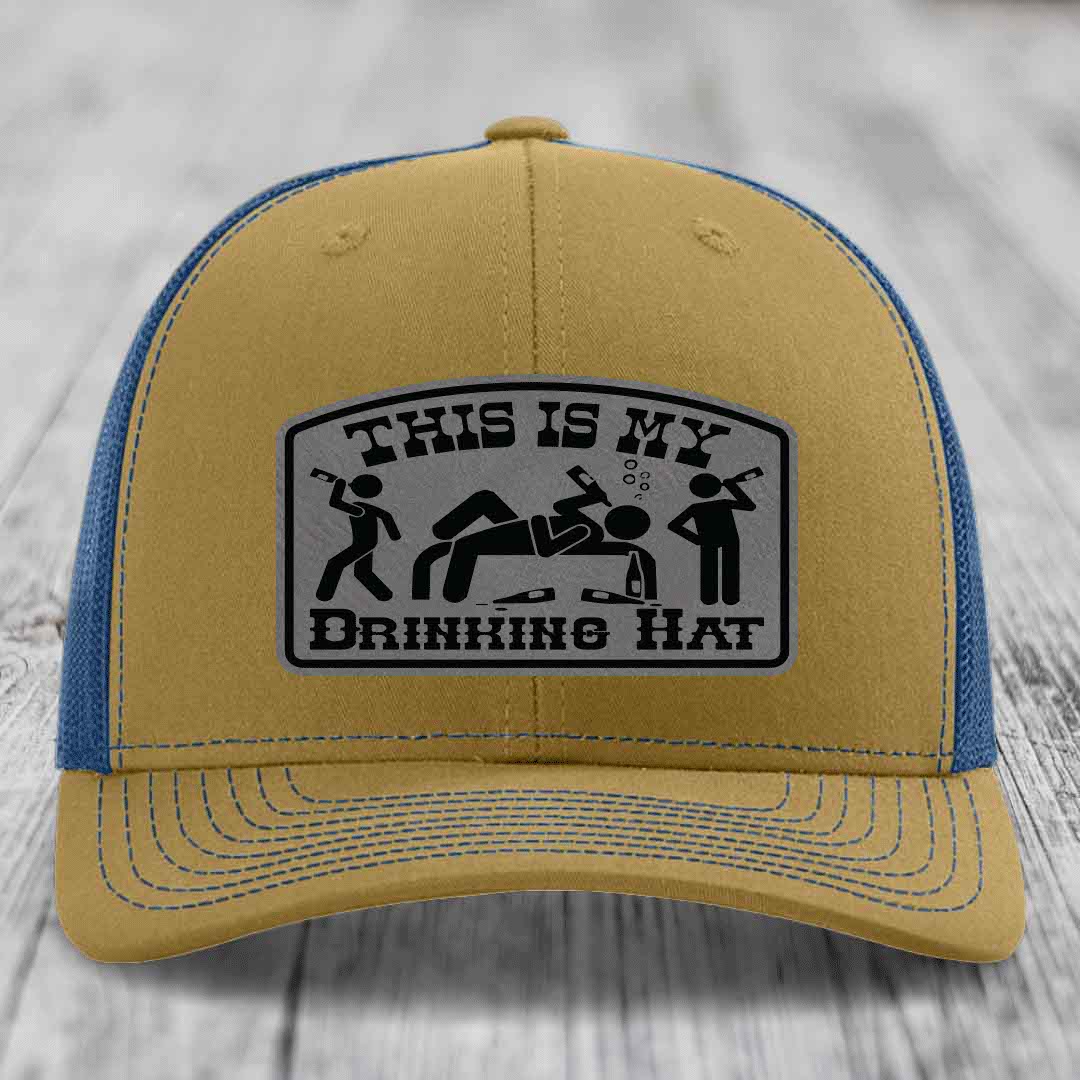 Tan and blue trucker hat with a black and grey &